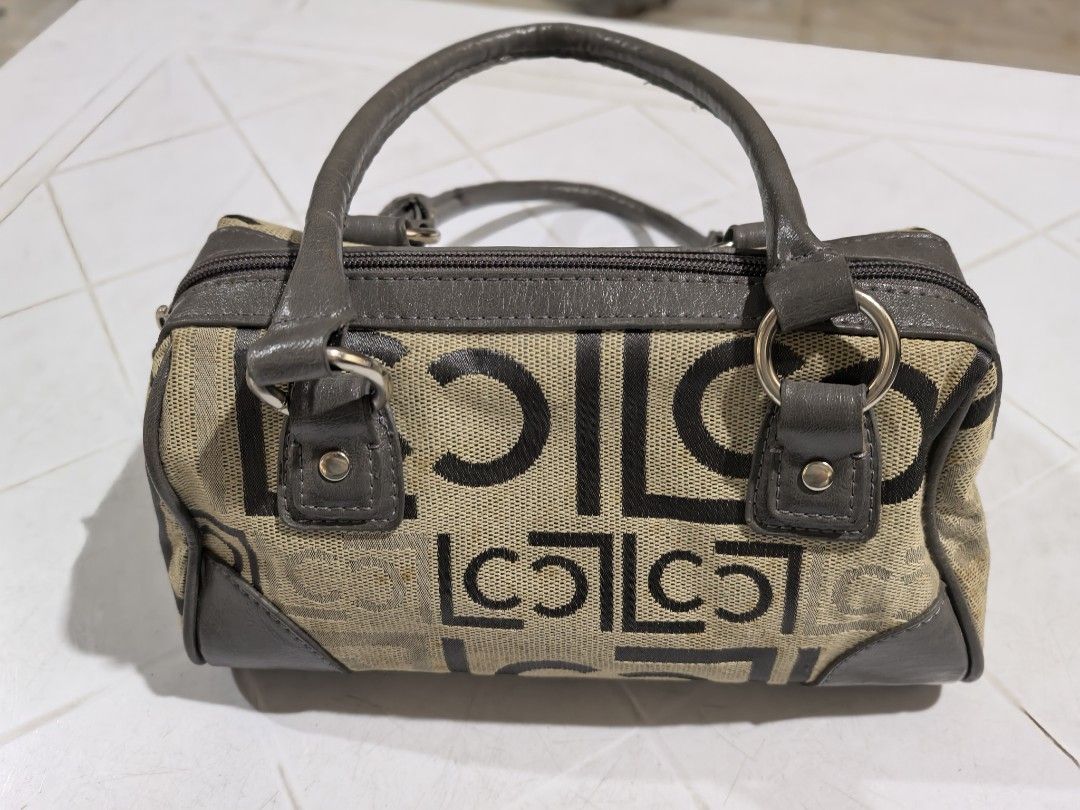 Liz Claiborne patterned barrel handbag (Category: Shoulder Bags) located in Manila. Submitted by jsu2026 (Listing ID 1470501079, Image 1). Description: - Brand: Liz Claiborne - Style: Barrel bag / Satchel - Color/Pattern: Beige and dark brown monogram canvas with grey faux leather trim and top handles - Closure: Zip-top closure - Interior: Plaid fabric lining with one zippered pocket and brand patch - Condition: Handles show regular handling wear