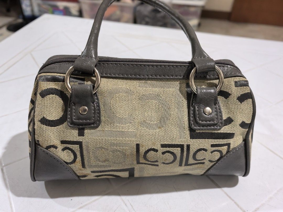 Liz Claiborne patterned barrel handbag (Category: Shoulder Bags) located in Manila. Submitted by jsu2026 (Listing ID 1470501079, Image 2). Description: - Brand: Liz Claiborne - Style: Barrel bag / Satchel - Color/Pattern: Beige and dark brown monogram canvas with grey faux leather trim and top handles - Closure: Zip-top closure - Interior: Plaid fabric lining with one zippered pocket and brand patch - Condition: Handles show regular handling wear