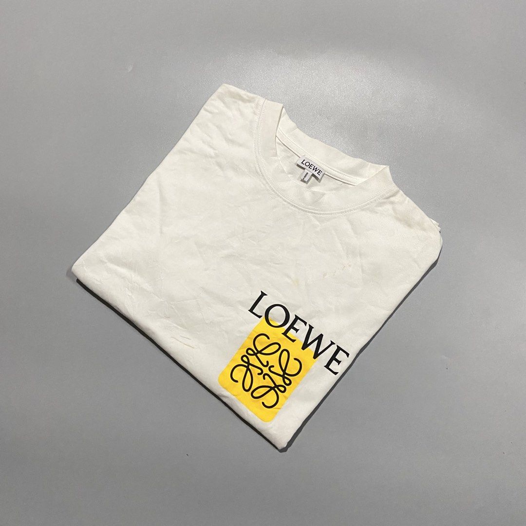 Loewe Anagram Tee (Category: Formal Shirts) located in Cebu City. Submitted by johngregmoldez03 (Listing ID 1470469411, Image 3). Description: Loewe Anagram Tee Size: Medium on tag Dimension: 22 Width / 27 Length Color Rate: 10/10 Excellent Condition - Need Wash / Slightly yellow stain Pm📩.