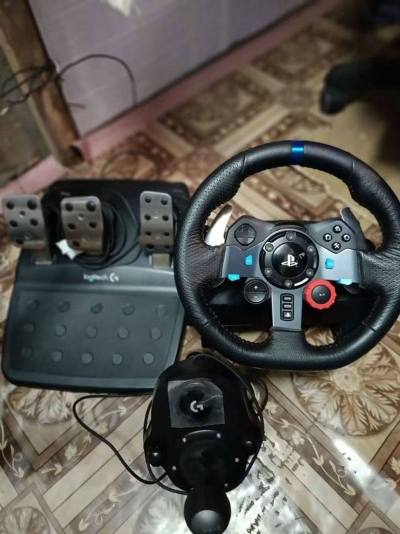Logitech G29 Driving Force Racing Wheel + Pedals + Shifter Bundle (Category: Other Accessories) located in Manila. Submitted by youngcloud.b6ee02 (Listing ID 1470366350, Image 1). Description: FOR SALE: Logitech G29 Driving Force Racing Wheel Set DESCRIPTION: -Dual-Motor Force Feedback: Realistic driving sensations with responsive steering feedback that simulates road conditions, tire grip, and vehicle handling. -900° Wheel Rotation: 2.5 turns lo