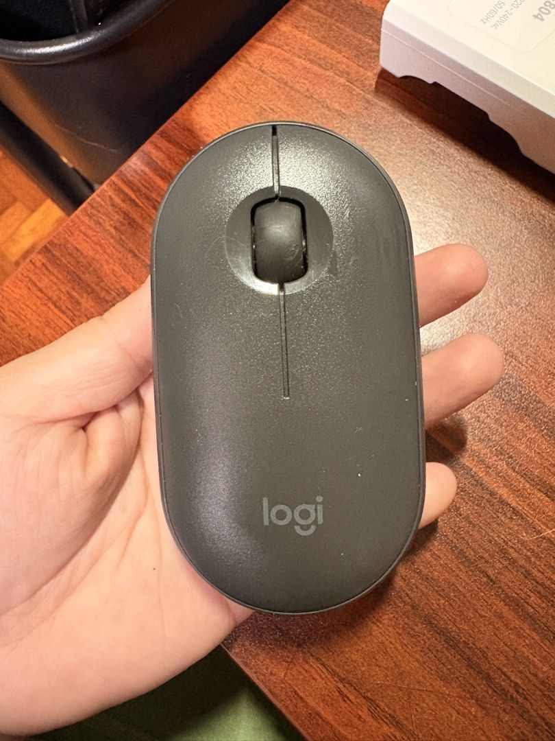 Logitech Pebble M350 Wireless Mouse Dark Gray (Category: Mouse & Mousepads) located in Manila. Submitted by karellevic16181 (Listing ID 1470465010, Image 1). Description: - Logitech Pebble M350 Wireless Mouse - Color: Dark Gray - Connectivity: Bluetooth pairing with a convenient button on the bottom - Moderately used on WFO days - Performance: Smooth scroll wheel and reliable optical sensor that works on most flat surfaces RFS extra, pandemic spl