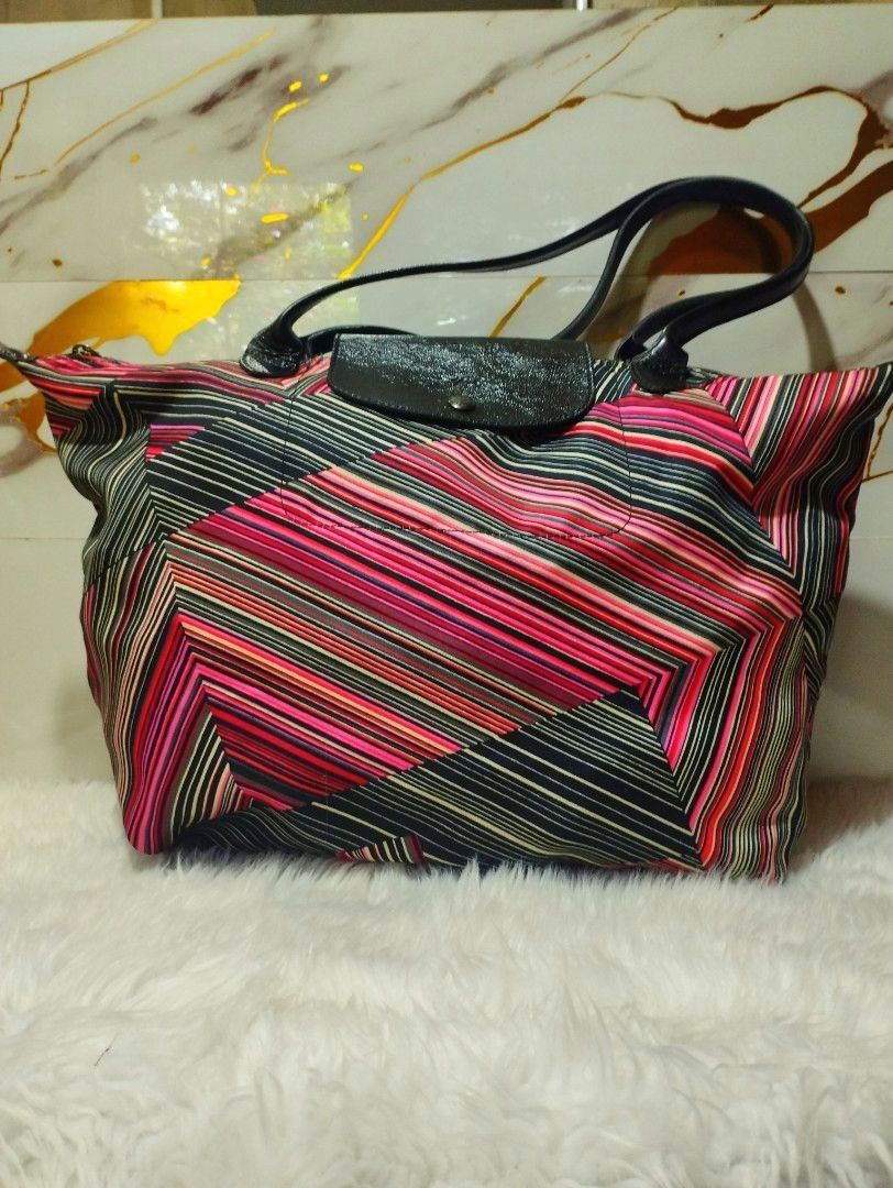 Longchamp Geometric Striped Tote Bag (Category: Tote Bags) located in Davao. Submitted by lolitfashioncorner.ph (Listing ID 1470412626, Image 1). Description: - Authentic Longchamp tote bag - Striking geometric stripe pattern in pink, black, and white - Comfortable long handles for easy shoulder wear - Secure top zipper closure with branded pull tab and YKK hardware - Classic snap flap accent - Spacious interior ideal for daily essentials - Made 