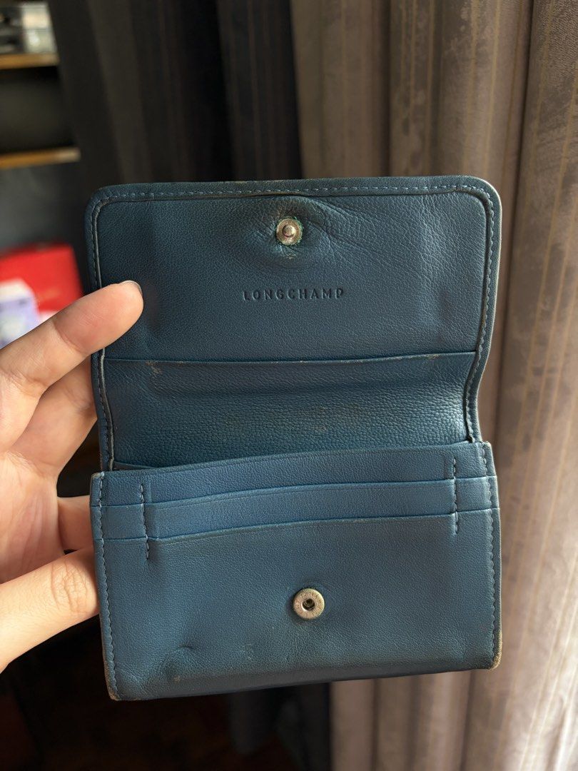 Longchamp leather wallet (Category: Wallets & Card Holders) located in Quezon City. Submitted by jocelyn__18 (Listing ID 1470389337, Image 3). Description: Authentic from France but heavily used. Bought around 10k..