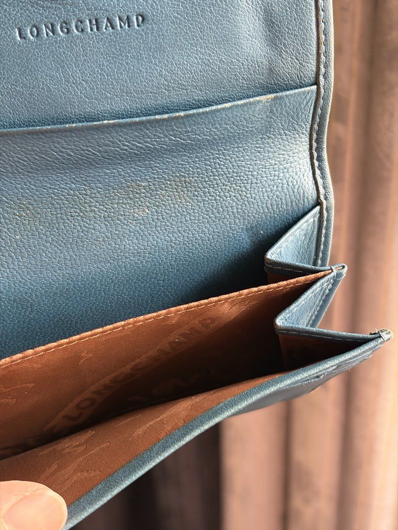 Longchamp leather wallet (Category: Wallets & Card Holders) located in Quezon City. Submitted by jocelyn__18 (Listing ID 1470389337, Image 2). Description: Authentic from France but heavily used. Bought around 10k..