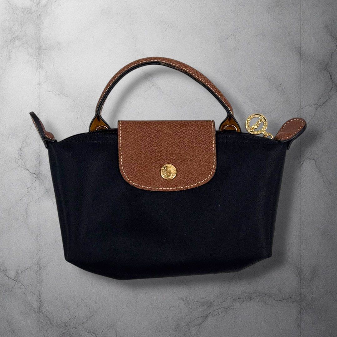 Longchamp Pouch Sling Shoulder Bag w Handle (Category: Sling Bags) located in Cavite. Submitted by itsayaaa (Listing ID 1470542252, Image 1). Description: No issue Excellent Condition .