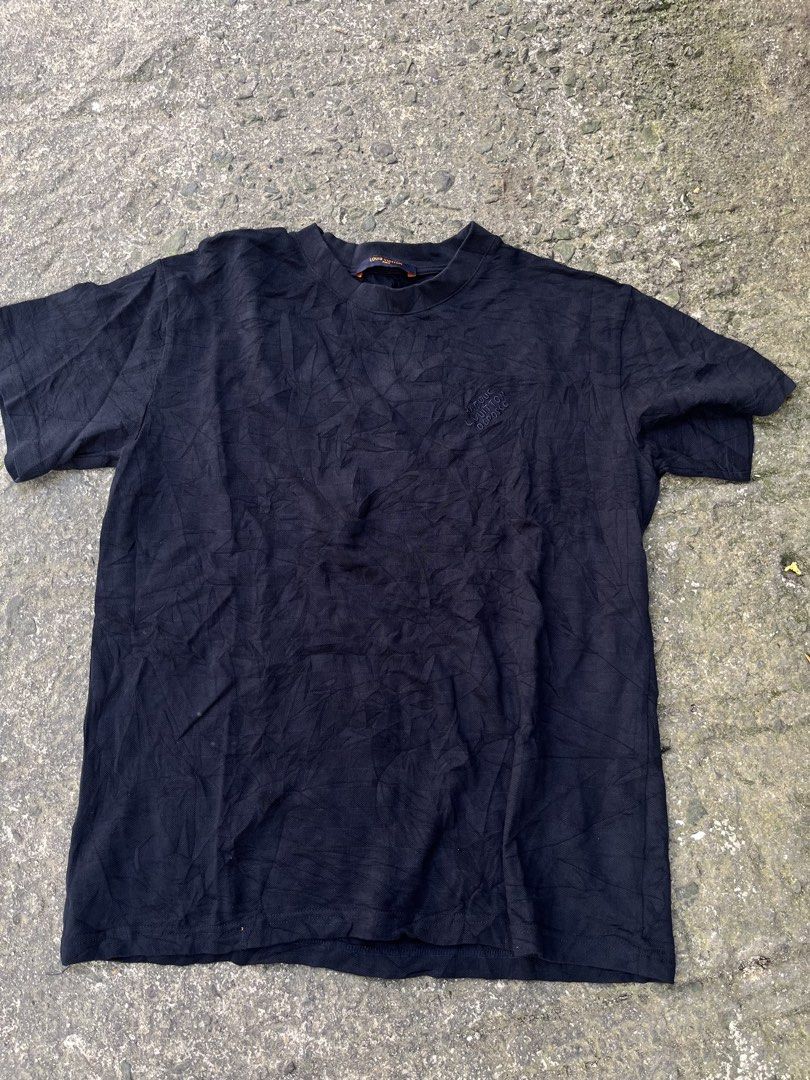 Louis Vuitton Black T-Shirt Size S (Category: Tshirts & Polo Shirts ) located in Manila. Submitted by shanaaa.collects (Listing ID 1470394132, Image 1). Description: Black Louis Vuitton t-shirt in size S, made in Italy. Subtle textured fabric with embroidered "Marque L. Vuitton Déposée" text on the chest. Classic crewneck style with orange tag details inside the collar. Standard fit, versatile basic piece from the luxury brand..