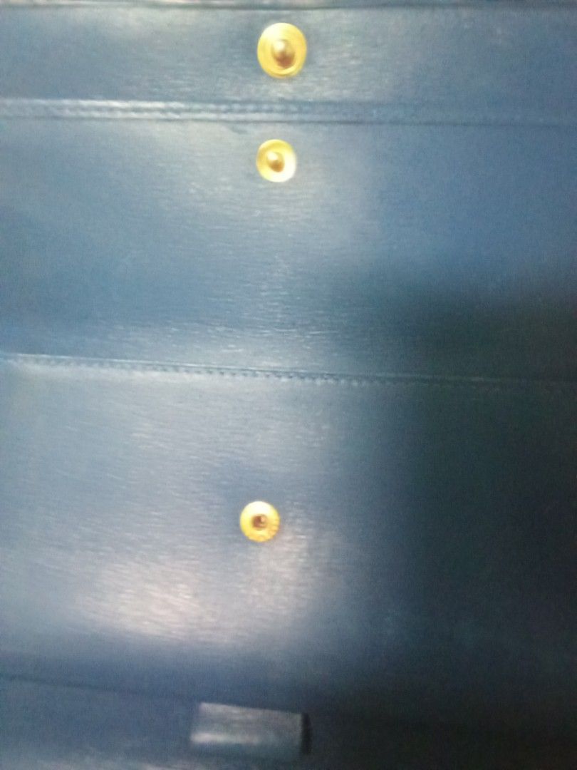 Louis Vuitton Blue Epi Leather Long Wallet (Category: Luxury Bags & Wallets) located in Manila. Submitted by coffeepup18 (Listing ID 1470355574, Image 2). Description: - Authentic Louis Vuitton long wallet crafted from durable blue Epi leather - Structured trifold design with a secure front snap button closure - Features elegant gold-tone hardware accents - Heat-stamped Louis Vuitton Paris, Made in Spain logo inside - Compact and sleek shape, per