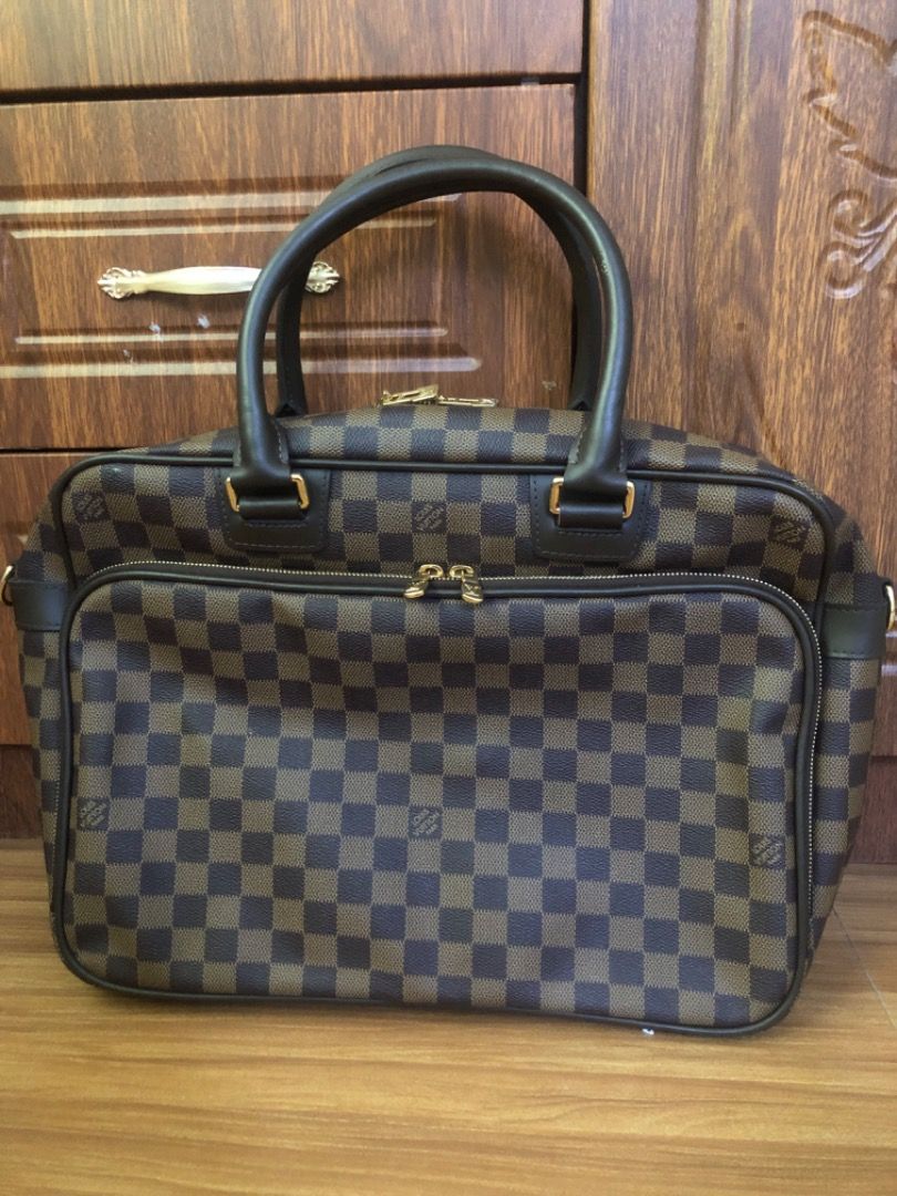 Louis Vuitton Damier Ebene Business Briefcase (Category: Luxury Bags & Wallets) located in Lucena. Submitted by gracious_chin0436 (Listing ID 1470353522, Image 1). Description: - briefcase in a classic brown and dark brown checkered canvas - Sturdy top handles and dual zip top closure for secure everyday use - Large front zipped compartment for easy organization - Elegant gold tone hardware with side rings for adding a shoulder strap - Spacious i