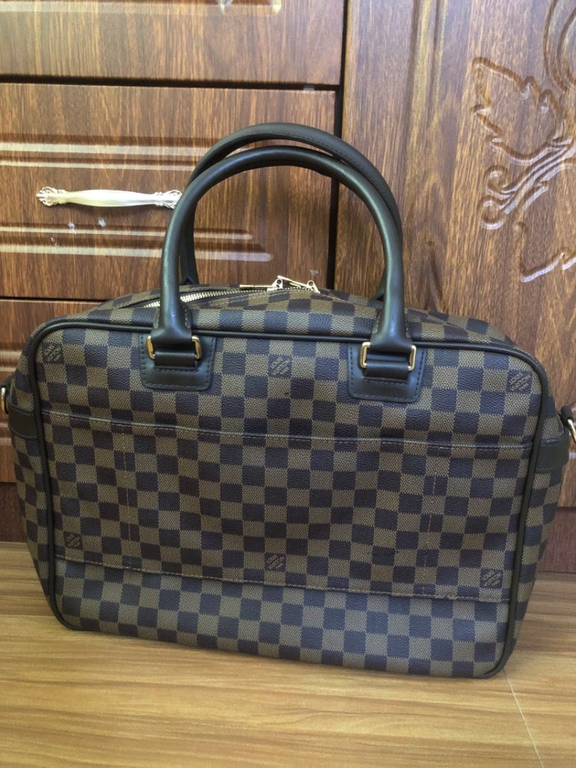 Louis Vuitton Damier Ebene Business Briefcase (Category: Luxury Bags & Wallets) located in Lucena. Submitted by gracious_chin0436 (Listing ID 1470353522, Image 2). Description: - briefcase in a classic brown and dark brown checkered canvas - Sturdy top handles and dual zip top closure for secure everyday use - Large front zipped compartment for easy organization - Elegant gold tone hardware with side rings for adding a shoulder strap - Spacious i