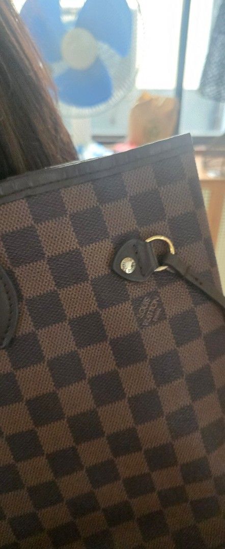 Louis Vuitton Damier Ebene Tote Handbag (Category: Luxury Bags & Wallets) located in Quezon City. Submitted by PreLovedByMrsAL (Listing ID 1470378835, Image 3). Description: - Louis Vuitton tote bag in iconic Damier Ebene canvas - Classic brown checkered pattern with durable dark brown leather handles - Elegant gold-tone hardware accents self authenticate.