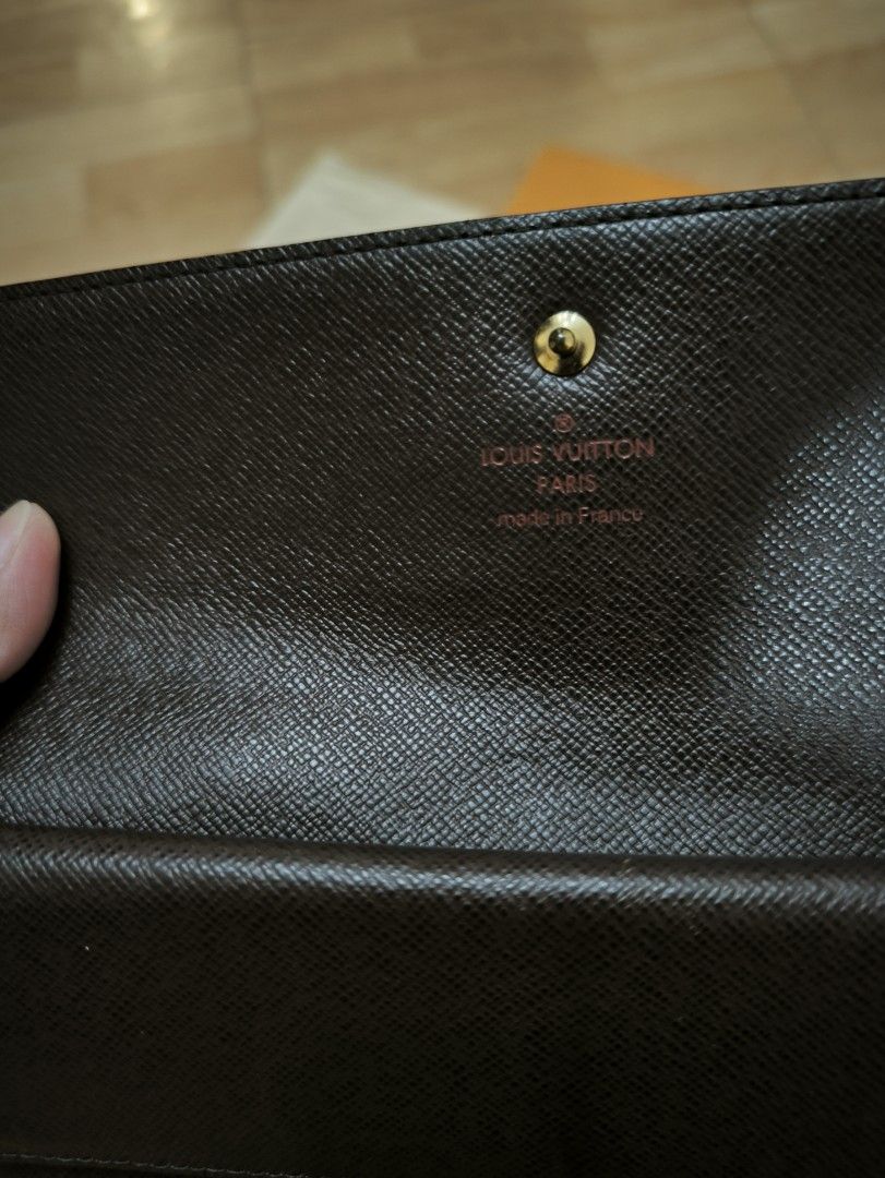 Louis Vuitton Damier Ebene wallet (Category: Wallets & Card holders) located in Manila. Submitted by wearforce (Listing ID 1470502532, Image 3). Description: LV (Louis Vuitton) Damier Ebene long trifold wallet (authentic) with multiple card slots and bill compartment snap button closure coded with original box and dust bag no crack, no bakbak fresh in and out 21,500 + SF (open for lalamove or meet up) rfs: Di nagagamit guaranteed authentic money 