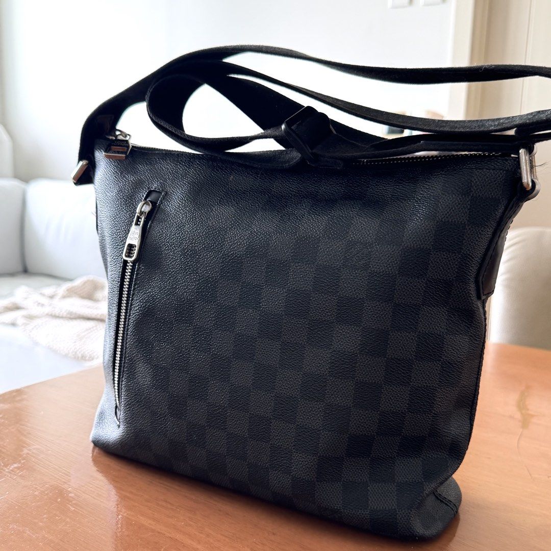 Louis Vuitton Mick PM Damier Graphite Crossbody Bag (Category: Luxury Bags & Wallets) located in Cebu City. Submitted by robie88 (Listing ID 1470485613, Image 2). Description: Louis Vuitton Mick PM crossbody bag in Damier Graphite canvas. Black and grey checkered pattern with dark hardware and an adjustable shoulder strap. Exterior zipped pocket on the front. Spacious interior compartment with a top zip closure. Monogram tag label reads N41211 Mi