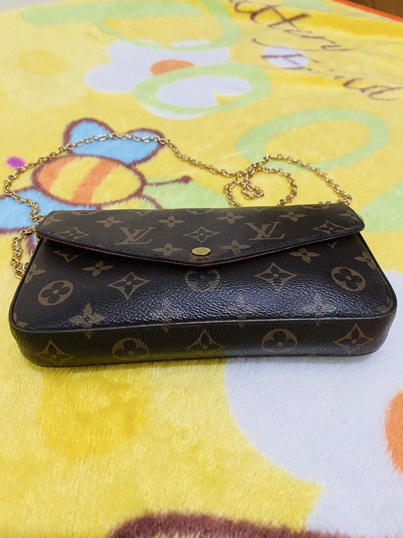 Louis Vuitton Monogram Canvas Envelope Chain Crossbody Bag (Category: Luxury Bags & Wallets) located in San Jose del Monte. Submitted by cityhanter007 (Listing ID 1470517405, Image 3). Description: - Louis Vuitton monogram coated canvas crossbody bag - Classic brown canvas with elegant gold-tone hardware - Secure envelope style flap closure with a snap button - Versatile removable chain strap with side dog clips - Clean dark brown interior lining