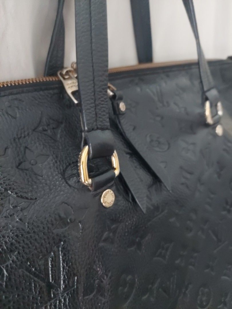 Louis Vuitton Monogram Empreinte Black Leather Tote Bag (Category: Luxury Bags & Wallets) located in Quezon City. Submitted by never_a_clutter (Listing ID 1470390786, Image 2). Description: - Brand: Louis Vuitton - Material: Monogram Empreinte leather in classic black - Hardware: Gold-toned accents - Features: Embossed monogram pattern, front zipped pocket, dual shoulder straps, secure zip top closure, and interior D-ring - Condition: Shows minor