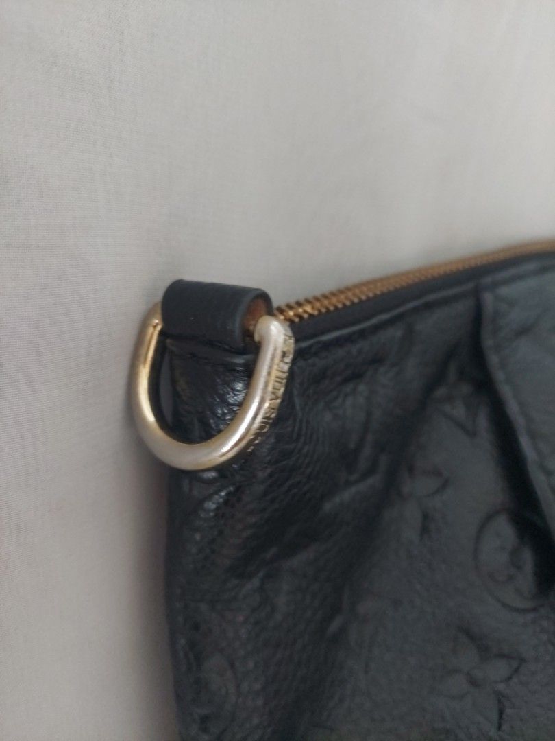 Louis Vuitton Monogram Empreinte Black Leather Tote Bag (Category: Luxury Bags & Wallets) located in Quezon City. Submitted by never_a_clutter (Listing ID 1470390786, Image 3). Description: - Brand: Louis Vuitton - Material: Monogram Empreinte leather in classic black - Hardware: Gold-toned accents - Features: Embossed monogram pattern, front zipped pocket, dual shoulder straps, secure zip top closure, and interior D-ring - Condition: Shows minor