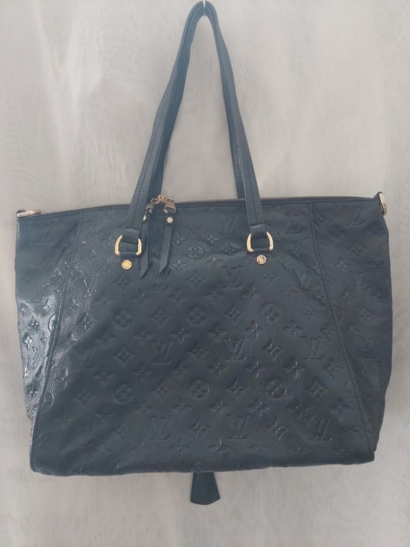 Louis Vuitton Monogram Empreinte Black Leather Tote Bag (Category: Luxury Bags & Wallets) located in Quezon City. Submitted by never_a_clutter (Listing ID 1470390786, Image 1). Description: - Brand: Louis Vuitton - Material: Monogram Empreinte leather in classic black - Hardware: Gold-toned accents - Features: Embossed monogram pattern, front zipped pocket, dual shoulder straps, secure zip top closure, and interior D-ring - Condition: Shows minor