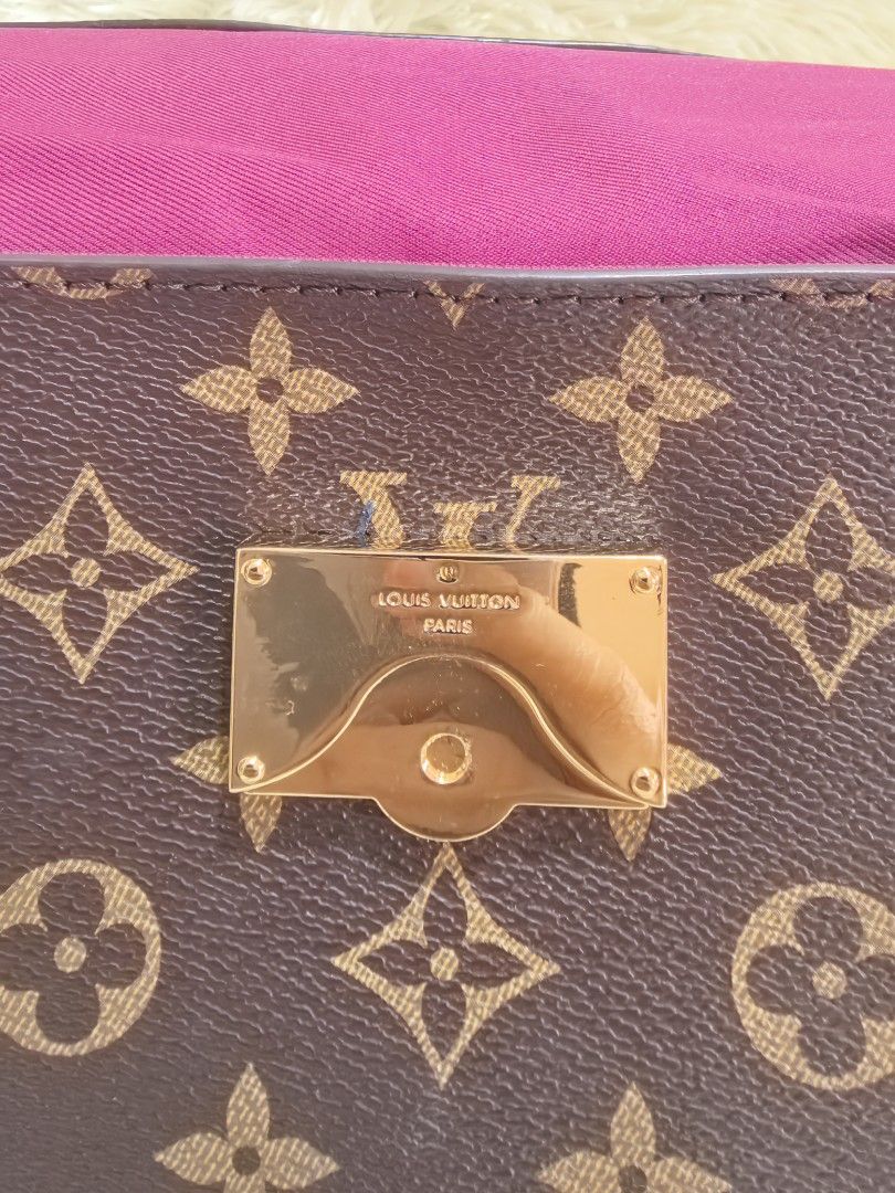 Louis Vuitton Monogram Handbag with Top Handle (Category: Luxury Bags & Wallets) located in Tacloban City. Submitted by thead.declutters (Listing ID 1470556485, Image 2). Description: - Authentic Louis Vuitton monogram canvas handbag - Classic brown and tan monogram pattern with structured shape - Elegant top handle and luxury gold-tone hardware - Secure front flap with snap closure - Vibrant pink fabric interior lining - Includes Louis Vuitton P