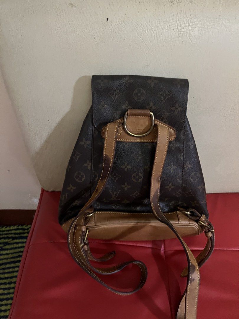 Louis Vuitton Monogram Montsouris GM Backpack (Category: Luxury Bags & Wallets) located in Victorias. Submitted by lan1877 (Listing ID 1470453673, Image 2). Description: - Authentic Monogram canvas body with classic vachetta leather base, straps, and trim - Secure drawstring closure under a front flap buckle plus a convenient exterior zip pocket - Clean interior fabric lining with stamped date code: SP0071 - Elegant gold-tone hardware throughout 