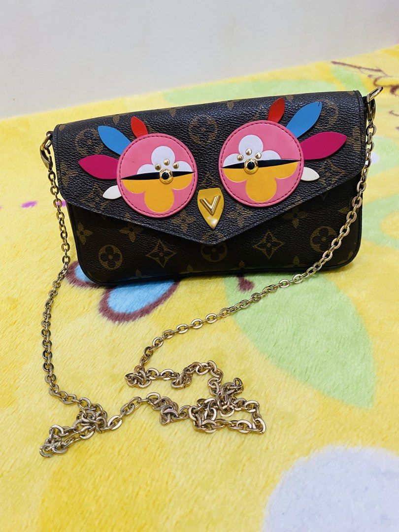 Louis Vuitton Monogram Owl Animation Chain Wallet Bag (Category: Luxury Bags & Wallets) located in San Jose del Monte. Submitted by cityhanter007 (Listing ID 1470515233, Image 1). Description: Louis Vuitton monogram canvas chain bag with playful colorful owl appliques on the front flap. Monogram pattern throughout the body. Gold-tone chain strap included. Envelope flap closure with a triangular V hardware piece serving as the owl beak. Compact st