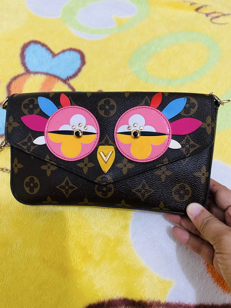 Louis Vuitton Monogram Owl Animation Chain Wallet Bag (Category: Luxury Bags & Wallets) located in San Jose del Monte. Submitted by cityhanter007 (Listing ID 1470515233, Image 3). Description: Louis Vuitton monogram canvas chain bag with playful colorful owl appliques on the front flap. Monogram pattern throughout the body. Gold-tone chain strap included. Envelope flap closure with a triangular V hardware piece serving as the owl beak. Compact st