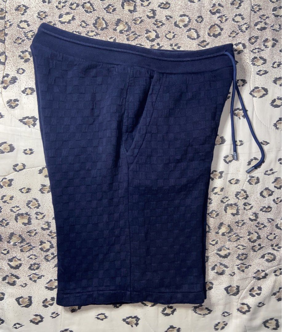 Louis Vuitton Monogram Textured Navy Blue Shorts (Category: Shorts) located in Manila. Submitted by nix.thrift (Listing ID 1470410443, Image 2). Description: - Authentic Louis Vuitton navy blue shorts - Features a subtle all-over textured pattern - Comfortable soft knit waistband with adjustable matching drawstring and metal aglets - Convenient front pockets for daily essentials - Inside branded neck label and care tag intact - Versatile dark blu