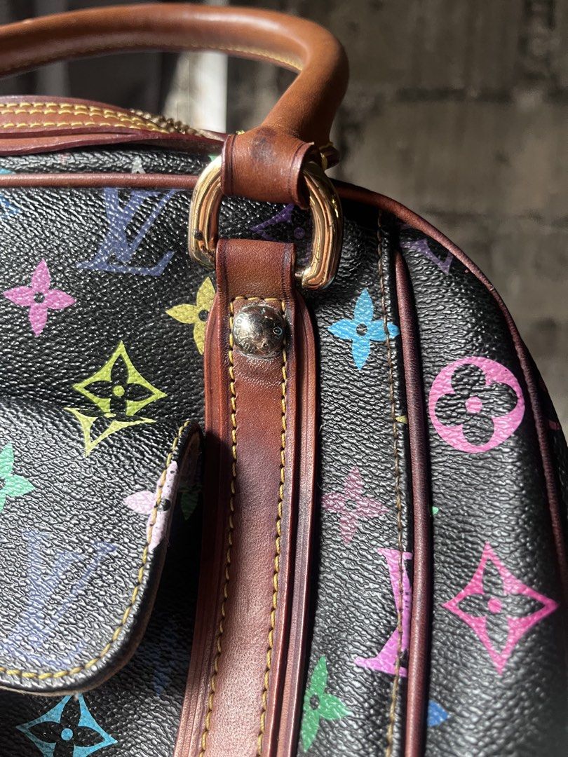 Louis Vuitton Multicolore Monogram Handbag (Category: Luxury Bags & Wallets) located in Manila. Submitted by madecuratedwithlove11 (Listing ID 1470422636, Image 3). Description: - Louis Vuitton Black Multicolore Monogram canvas handbag - Chic tan leather trim with signature contrast yellow stitching - Secure front flap pocket with buckle closure - Sturdy top handles with metallic hardware - Classic structured design with durable brown interior li