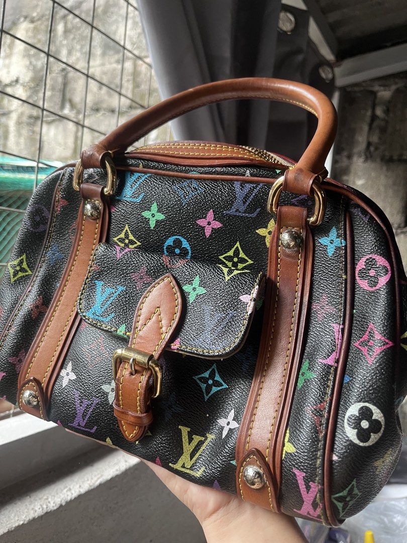 Louis Vuitton Multicolore Monogram Handbag (Category: Luxury Bags & Wallets) located in Manila. Submitted by madecuratedwithlove11 (Listing ID 1470422636, Image 1). Description: - Louis Vuitton Black Multicolore Monogram canvas handbag - Chic tan leather trim with signature contrast yellow stitching - Secure front flap pocket with buckle closure - Sturdy top handles with metallic hardware - Classic structured design with durable brown interior li