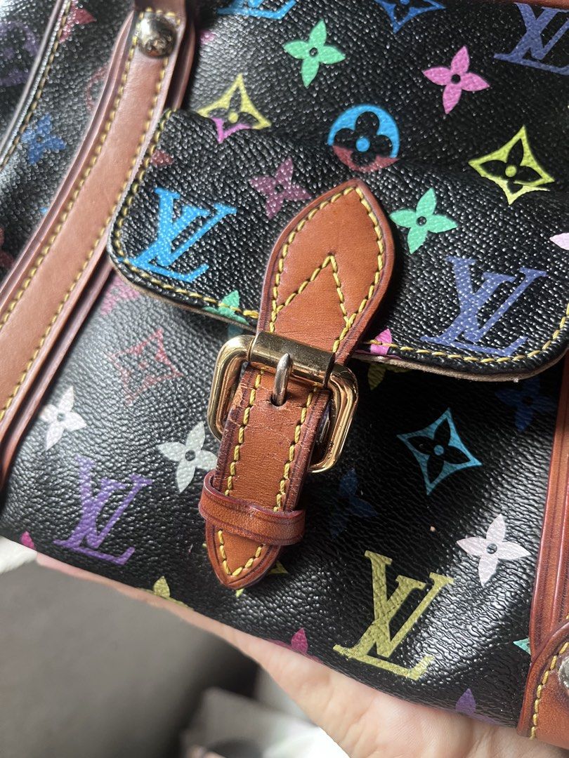 Louis Vuitton Multicolore Monogram Handbag (Category: Luxury Bags & Wallets) located in Manila. Submitted by madecuratedwithlove11 (Listing ID 1470422636, Image 2). Description: - Louis Vuitton Black Multicolore Monogram canvas handbag - Chic tan leather trim with signature contrast yellow stitching - Secure front flap pocket with buckle closure - Sturdy top handles with metallic hardware - Classic structured design with durable brown interior li