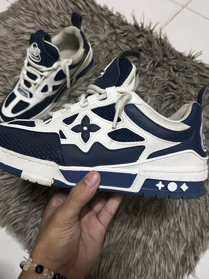 Louis Vuitton Skate Sneaker Blue White (Category: Sneakers) located in Manila. Submitted by john_ddd6 (Listing ID 1470489891, Image 3). Description: negotiable - Brand: Louis Vuitton - Style: Skate Sneakers (Blue & White) - Design: Chunky laces, mesh panels, and graphic flower motifs on sides and tongue - Details: Large 1854 branding patch on heel, back pull tab, and rubber sole with Vuitton text - Condition: Great styling piece with minor dirt m