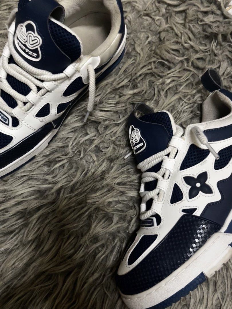Louis Vuitton Skate Sneaker Blue White (Category: Sneakers) located in Manila. Submitted by john_ddd6 (Listing ID 1470489891, Image 2). Description: negotiable - Brand: Louis Vuitton - Style: Skate Sneakers (Blue & White) - Design: Chunky laces, mesh panels, and graphic flower motifs on sides and tongue - Details: Large 1854 branding patch on heel, back pull tab, and rubber sole with Vuitton text - Condition: Great styling piece with minor dirt m