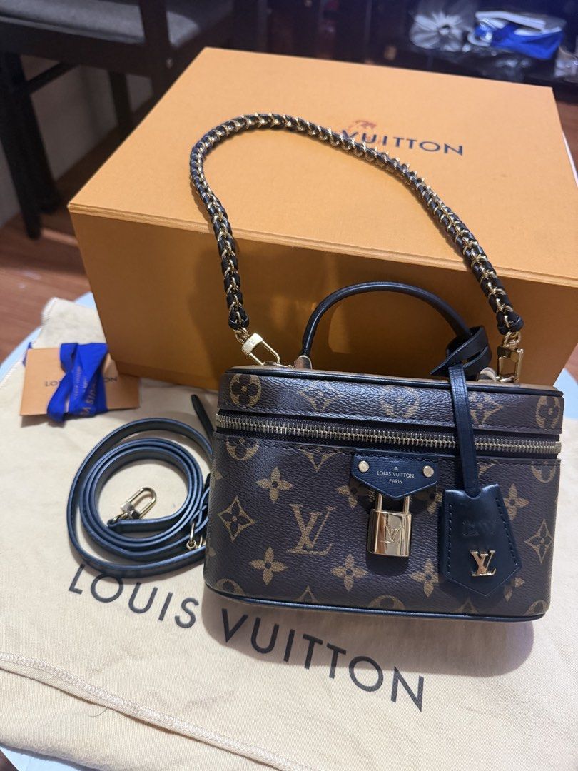 Louis Vuitton Vanity PM Monogram Reverse (Category: Luxury Bags & Wallets) located in Manila. Submitted by arcietan02437 (Listing ID 1470477610, Image 2). Description: - Monogram canvas vanity bag with sleek black leather trim and gold-tone hardware - Comes with a top handle, braided chain strap, and an extra leather strap - Secure wrap-around zip closure featuring a small padlock and clochette - Includes original box and dust bag - Clean interio