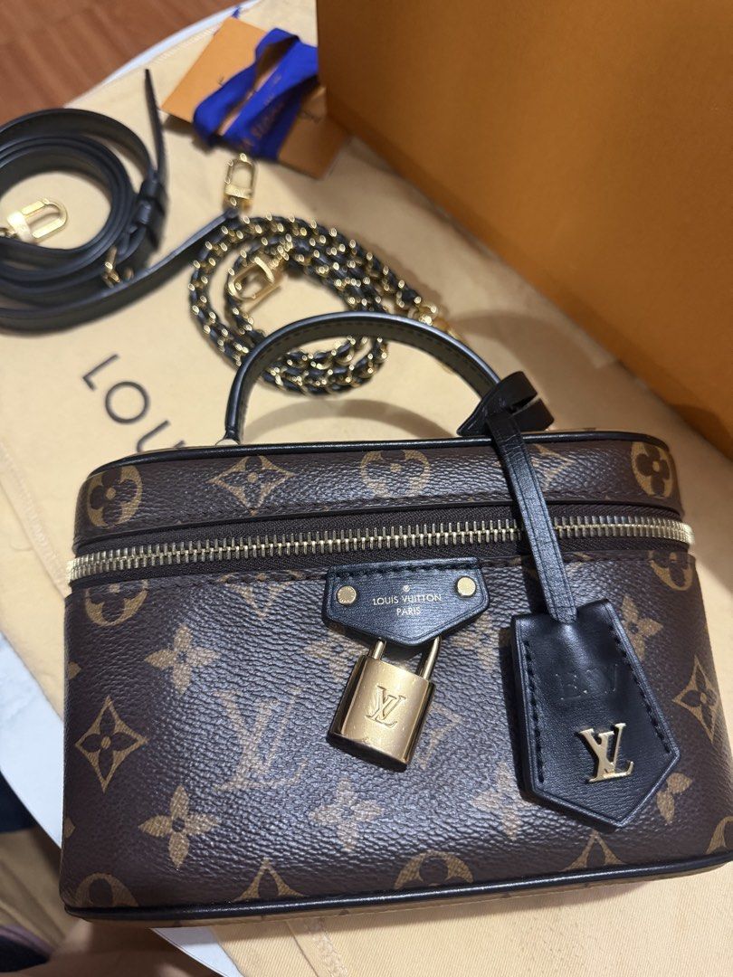 Louis Vuitton Vanity PM Monogram Reverse (Category: Luxury Bags & Wallets) located in Manila. Submitted by arcietan02437 (Listing ID 1470477610, Image 3). Description: - Monogram canvas vanity bag with sleek black leather trim and gold-tone hardware - Comes with a top handle, braided chain strap, and an extra leather strap - Secure wrap-around zip closure featuring a small padlock and clochette - Includes original box and dust bag - Clean interio