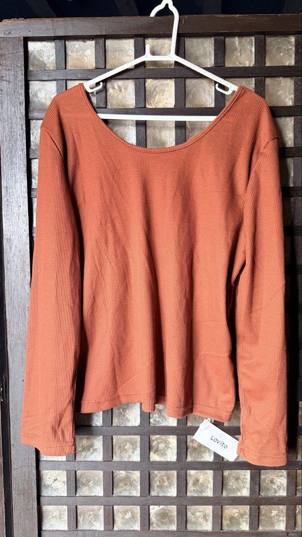 Lovito Rust Orange Long Sleeve Waffle Knit Top (Category: Longsleeves) located in Makati City. Submitted by rocelli28 (Listing ID 1470453819, Image 1). Description: - Brand: Lovito (Brand New with Tags) - Color: Rust Orange - Size: large to XL - Material: Soft, stretchy waffle knit fabric - Design: Scoop front neckline and deep V-shaped mesh and lace back panel - Fit: stretchy, lightweight, and comfortable.
