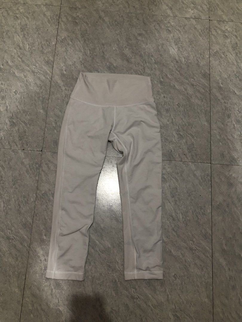 Lululemon Align Crop Leggings White Size 4 (Category: Activewear) located in Manila. Submitted by tanieel (Listing ID 1470462382, Image 1). Description: - Brand: Lululemon - Color: Classic White - Size: 4 (verified with dot tag in pocket) - Rise: High-rise waistband with signature logo at the back - Fabric: Super soft, buttery material - Best For: Yoga, workouts, or lounging - Condition: Clean and well-maintained.