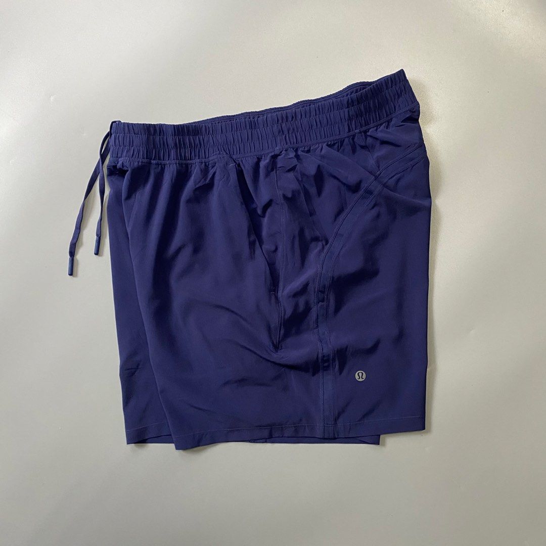 Lululemon Athletic Shorts Navy Blue (Category: Shorts) located in Pagadian. Submitted by 420thriftclothes (Listing ID 1470391717, Image 1). Description: - Brand: Lululemon - Color: Navy Blue - Condition: Clean, excellent overall - Waistband: Elastic with adjustable drawstring - Pockets: Secure zippered side pockets - Details: Reflective logo on the leg - Material: Lightweight and breathable, ideal for workouts and running.