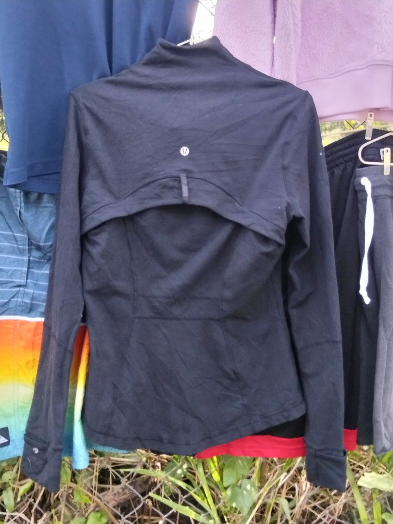 Lululemon Black Full Zip Activewear Jacket (Category: Coats, Jackets and Outerwear) located in Quezon City. Submitted by quyss (Listing ID 1470447218, Image 1). Description: - Brand: Lululemon - Color: Classic Black - Design: Full front zip with a stylish high collar - Features: Two front zippered pockets, thumbholes on long sleeves, and signature omega logo on the back collar - Ventilation: Back vent cutout for extra breathability - Ideal for: G