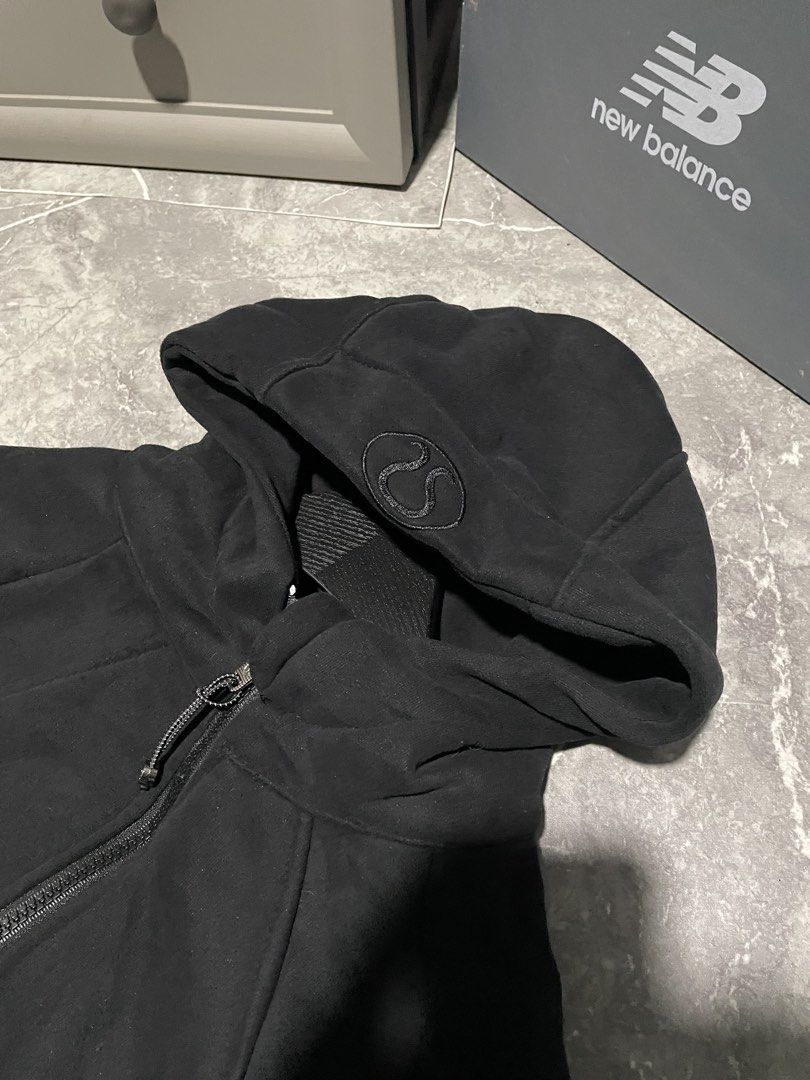 Lululemon Black Zip-Up Hoodie (Category: Coats, Jackets and Outerwear) located in Buenavista. Submitted by ivoperez27 (Listing ID 1470403568, Image 3). Description: - Brand: Lululemon - Color: Solid Black - 19 width 23.5 length - Style: Full-zip hoodie with long sleeves - Details: Signature logo zip pull, embroidered logo on the hood - Fit/Comfort: Ribbed side panels and cuffs for a great fit - Condition: Clean and well-maintained.