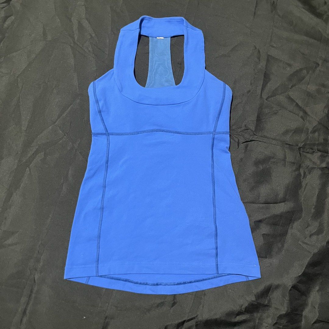 Lululemon Blue Athletic Tank Top with Racerback (Category: Activewear) located in Manila. Submitted by giormagne (Listing ID 1470446385, Image 3). Description: - Brand: Lululemon - Color: Bright blue - Design: Scoop neck front, racerback with a sheer blue back panel - Details: Classic silver omega logo on upper back, supportive ribbed seams along sides and waist - Versatility: Ideal for workouts, yoga, or everyday casual wear - Condition: Great p