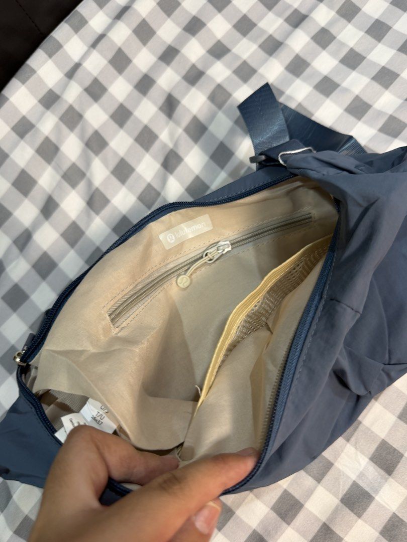 Lululemon Small Slouchy Sling Bag Blue (Category: Cross-body Bags) located in Makati City. Submitted by gigidvd (Listing ID 1470444942, Image 3). Description: - Lululemon Small Slouchy Sling Bag - Color: Blue - Material: Lightweight and durable nylon - Condition: Brand new - Strap: Adjustable for comfortable carrying - Exterior: Zippered pockets on both ends plus front slip pockets - Interior: Secure zip pocket and mesh compartments for easy orga