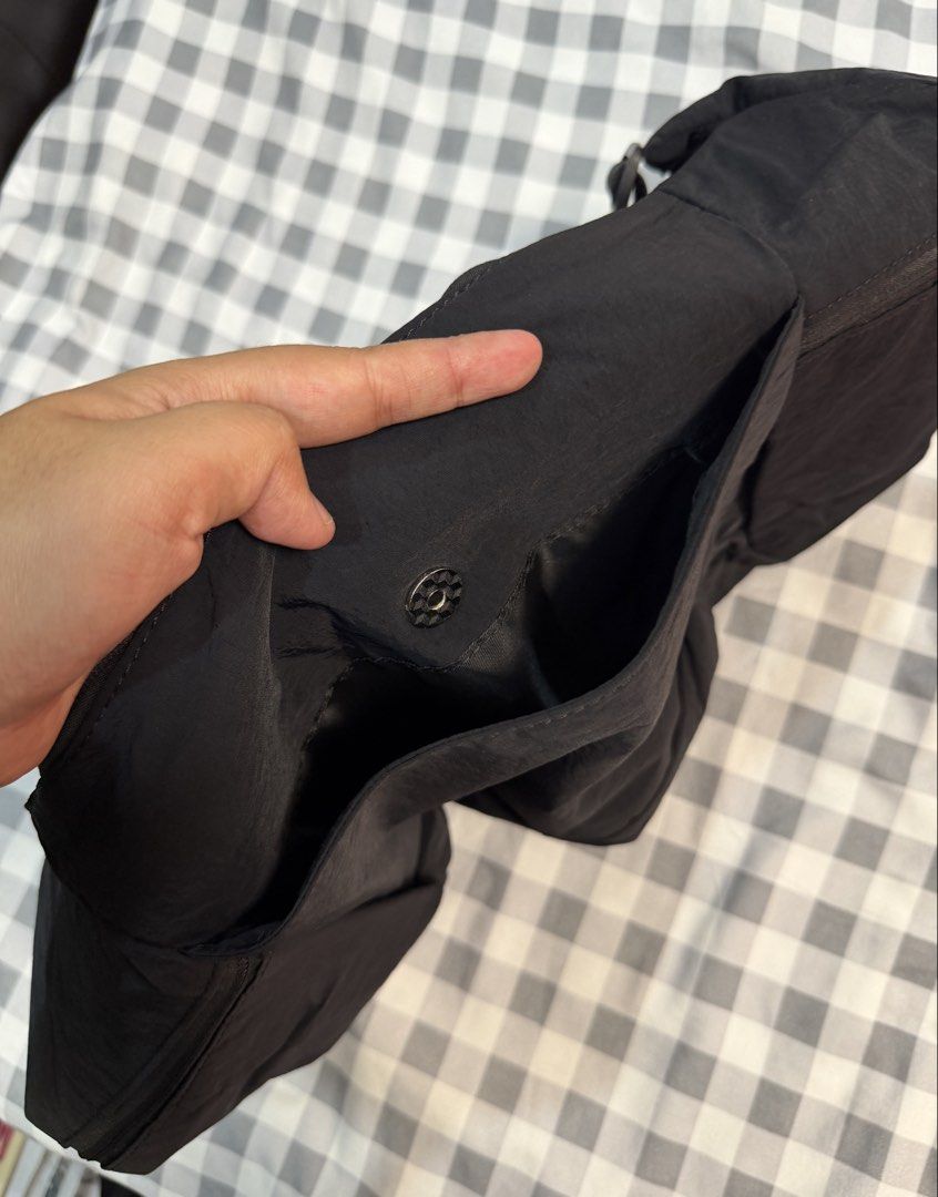 Lululemon Large Slouchy Sling Bag Black (Category: Cross-body Bags) located in Makati City. Submitted by gigidvd (Listing ID 1470444943, Image 3). Description: - Brand new Classic Black Slouchy Sling Bag - Curved silhouette that tucks close to the body - Adjustable shoulder strap for a custom fit - Storage: Zippered main compartment with interior organization pockets.
