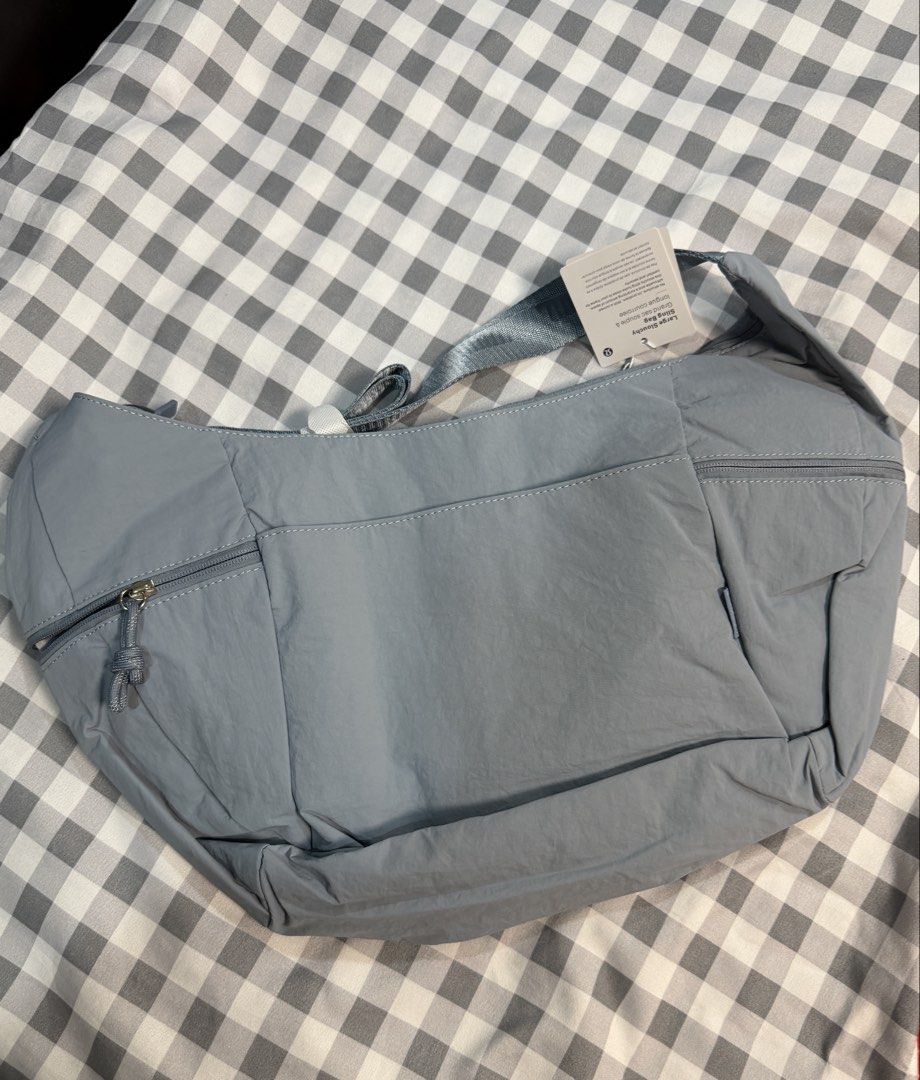 Lululemon Large Slouchy Sling Bag (Category: Cross-body Bags) located in Makati City. Submitted by gigidvd (Listing ID 1470444948, Image 2). Description: - Brand new Light Classic Blue Slouchy Sling Bag - Curved silhouette that tucks close to the body - Adjustable shoulder strap for a custom fit - Storage: Zippered main compartment with interior organization pockets.