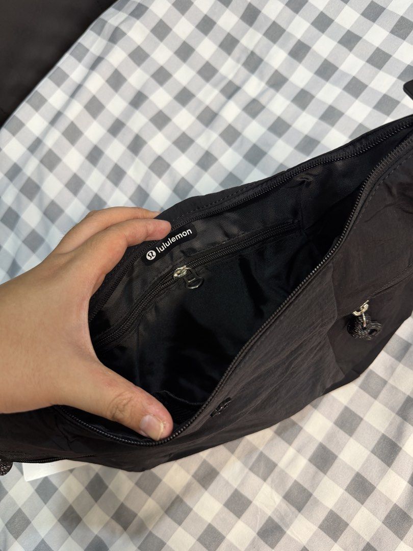 Lululemon Small Slouchy Slouchy Bag Black (Category: Cross-body Bags) located in Makati City. Submitted by gigidvd (Listing ID 1470444945, Image 3). Description: - Lululemon Small Slouchy Sling Bag - Color: Black - Material: Lightweight and durable nylon - Condition: Brand new - Strap: Adjustable for comfortable carrying - Exterior: Zippered pockets on both ends plus front slip pockets - Interior: Secure zip pocket and mesh compartments for easy 