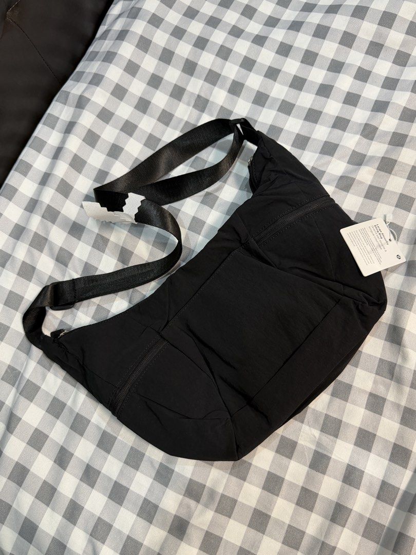 Lululemon Small Slouchy Slouchy Bag Black (Category: Cross-body Bags) located in Makati City. Submitted by gigidvd (Listing ID 1470444945, Image 2). Description: - Lululemon Small Slouchy Sling Bag - Color: Black - Material: Lightweight and durable nylon - Condition: Brand new - Strap: Adjustable for comfortable carrying - Exterior: Zippered pockets on both ends plus front slip pockets - Interior: Secure zip pocket and mesh compartments for easy 