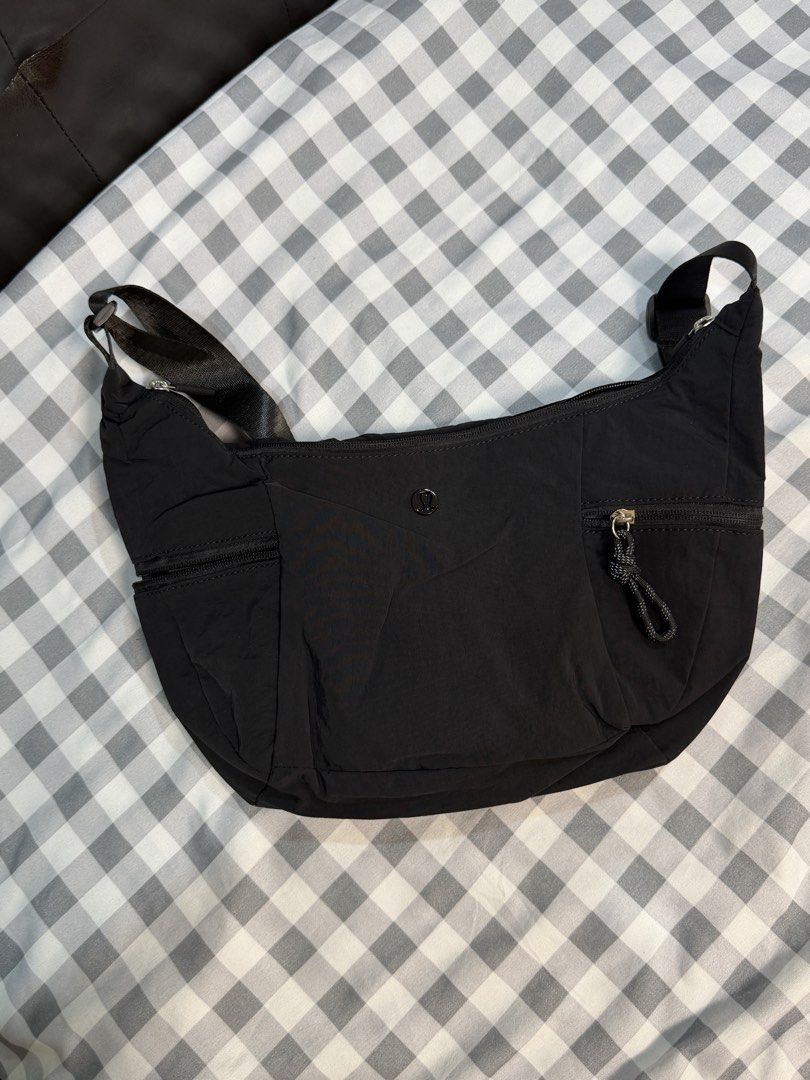Lululemon Small Slouchy Slouchy Bag Black (Category: Cross-body Bags) located in Makati City. Submitted by gigidvd (Listing ID 1470444945, Image 1). Description: - Lululemon Small Slouchy Sling Bag - Color: Black - Material: Lightweight and durable nylon - Condition: Brand new - Strap: Adjustable for comfortable carrying - Exterior: Zippered pockets on both ends plus front slip pockets - Interior: Secure zip pocket and mesh compartments for easy 