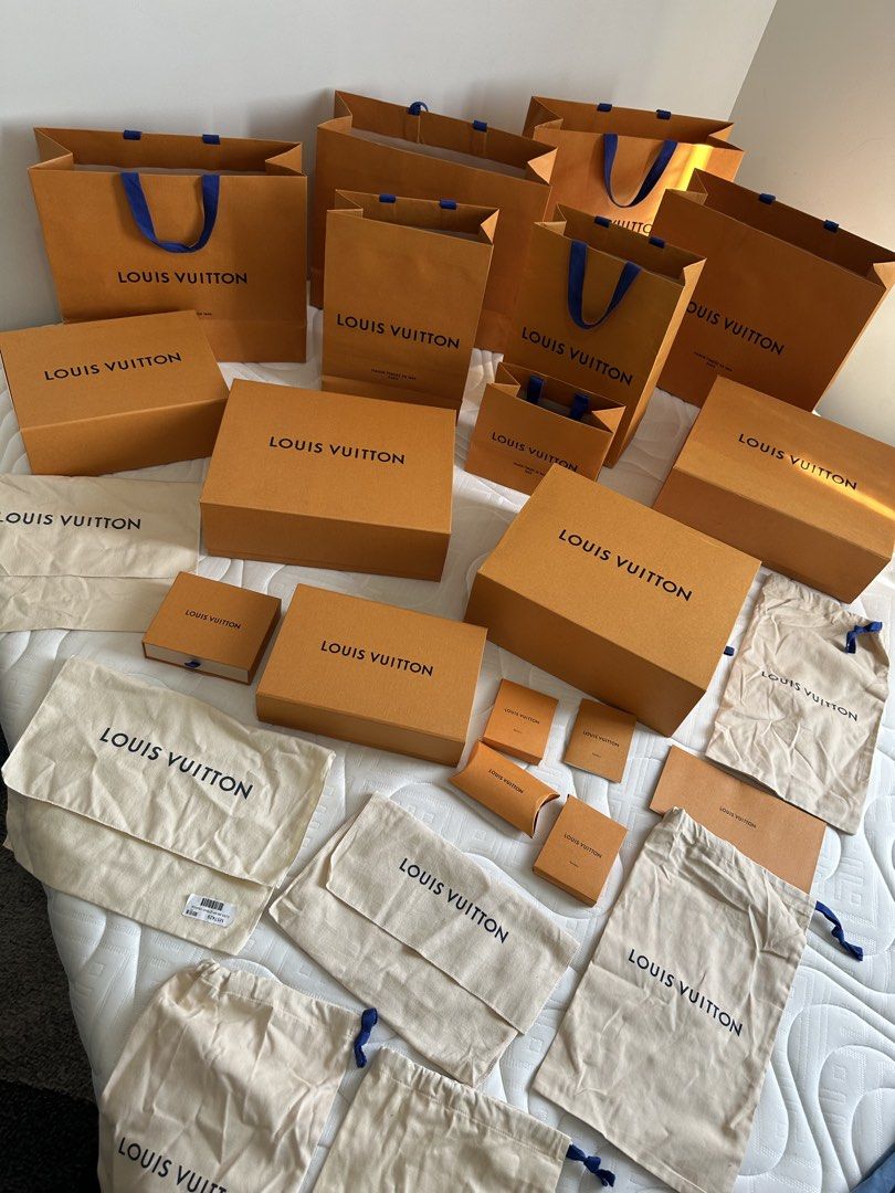 LV box, dust bag, and paper bag PER SET (Category: Luxury Bags & Wallets) located in Manila. Submitted by luxe_aethel (Listing ID 1470431435, Image 1). Description: - Authentic Louis Vuitton packaging bundle in clean, carefully stored condition - Includes multiple orange paper shopping bags in various sizes - Comes with various rigid gift boxes and small drawer boxes - Features signature cream dust bags with blue drawstrings - Perfect for gifting