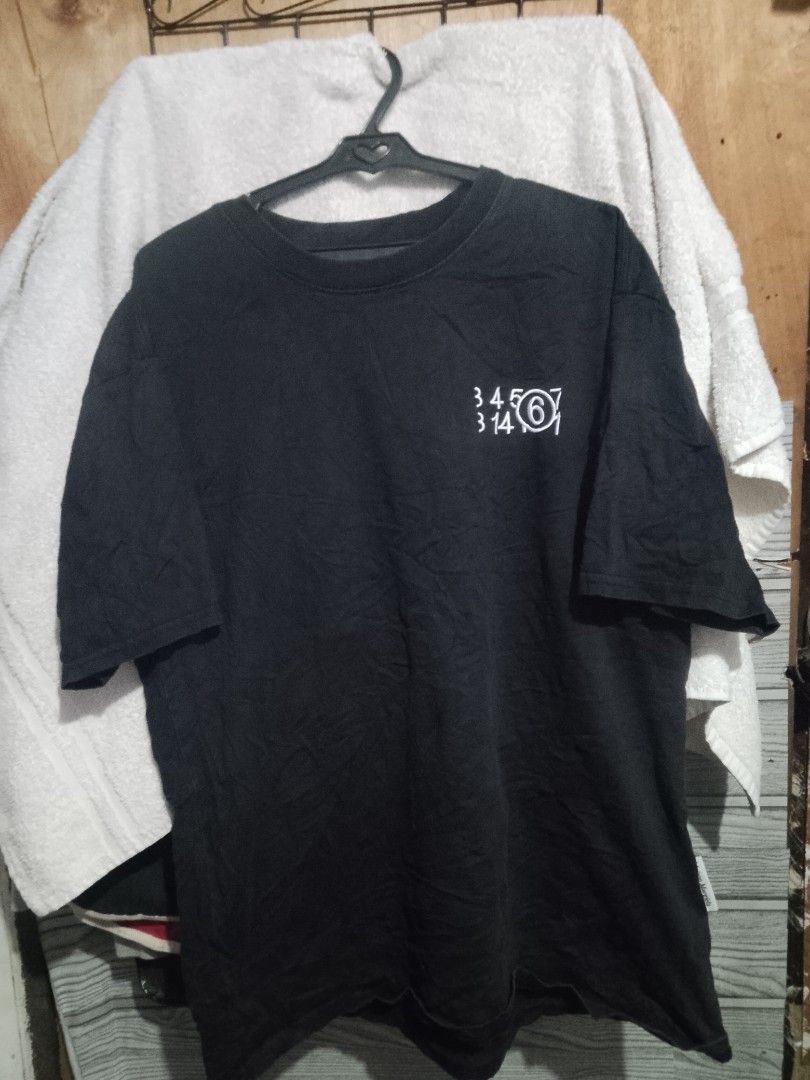 Maison Margiela MM6 Black Number Tee (Category: Shirts) located in Quezon City. Submitted by theoneshop1 (Listing ID 1470463062, Image 1). Description: - Brand: MM6 Maison Margiela - Color: Black with white number print on chest - Fit: Relaxed fit with classic crewneck - Details: Iconic four white stitches on the back neck - Material: Soft, premium cotton - Origin: Made in Italy.