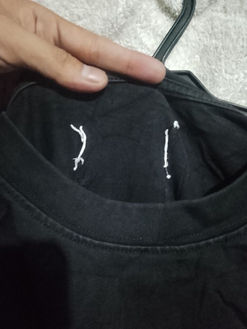 Maison Margiela MM6 Black Number Tee (Category: Shirts) located in Quezon City. Submitted by theoneshop1 (Listing ID 1470463062, Image 3). Description: - Brand: MM6 Maison Margiela - Color: Black with white number print on chest - Fit: Relaxed fit with classic crewneck - Details: Iconic four white stitches on the back neck - Material: Soft, premium cotton - Origin: Made in Italy.