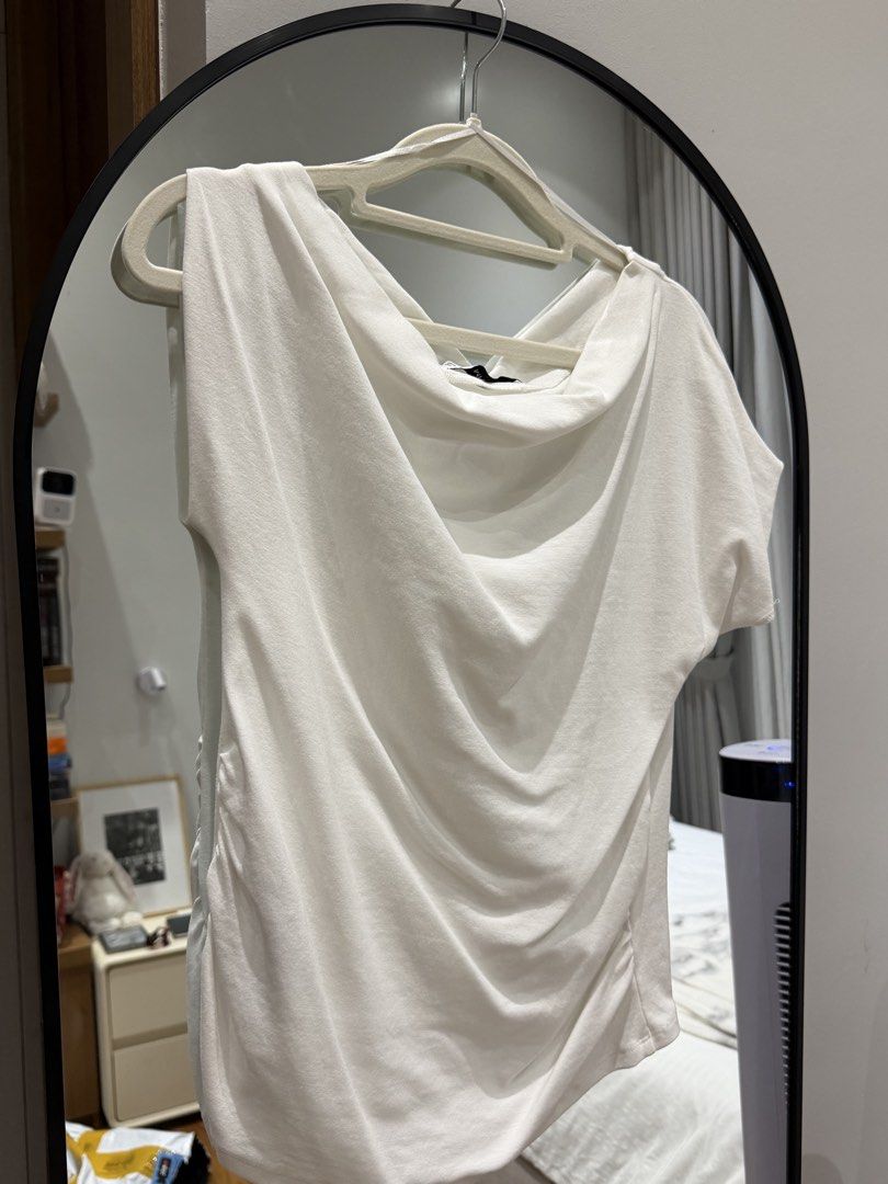 MANGO White Cowl Neck Draped Top Size L (Category: Blouses) located in Meycauayan. Submitted by m4teri4lgirl (Listing ID 1470510114, Image 2). Description: WORN ONCE - Brand: Mango - Color: White - Size: L (EUR/USA L, MEX G) - Neckline: Draped cowl neck - Details: Short sleeves, side ruching - Fabric: Soft and stretchy - Condition: Clean and ready to wear.