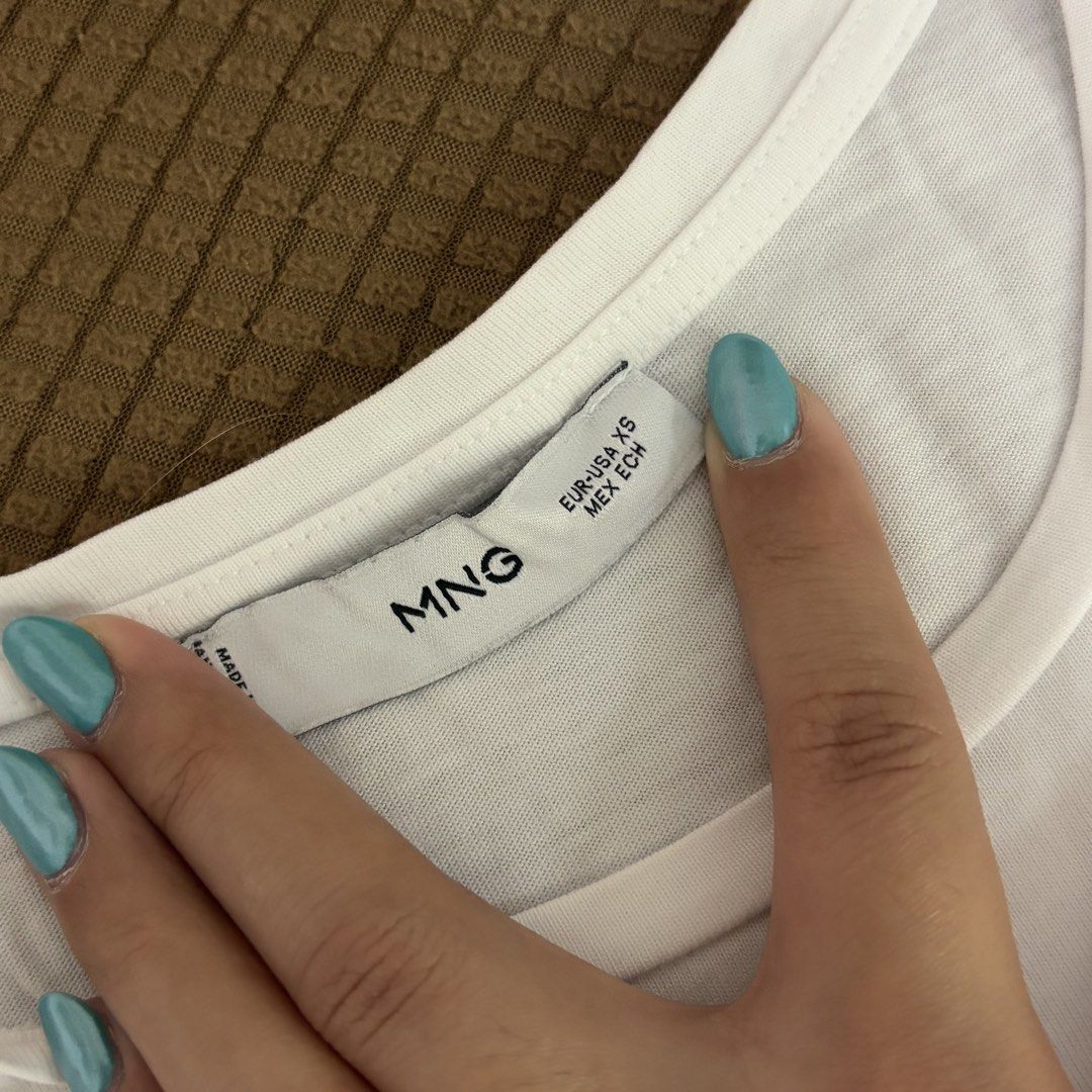 Mango White T-Shirt (Category: Shirts) located in Marikina City. Submitted by jellyselection (Listing ID 1470524896, Image 2). Description: - used twice only - flaws on pic, stain can be removed.