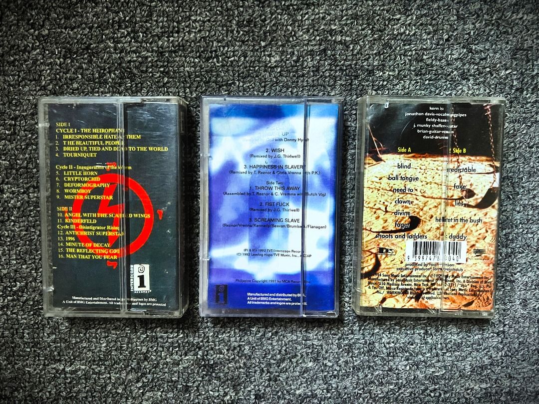 Marilyn Manson, NIN & Korn // 3-Cassette Tape Bundle (Category: CDs & DVDs) located in Cebu City. Submitted by tothephatcave (Listing ID 1470480060, Image 2). Description: Clearing out some massive heavy hitters from the Lighter Records vault at an absolute steal price! Unlike loose player tapes, these are complete with their original plastic cases and fold-out J-card artwork inserts. Available Tapes: Marilyn Manson – Antichrist Superstar (1996):